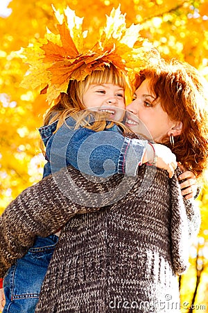 Daughter embracing mother Stock Photo