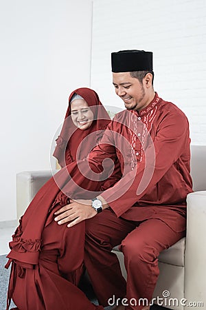 Daughter kneel bow to his parent for apologize Stock Photo