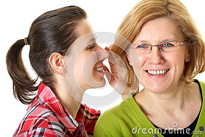 Daughter whisper to her mom, secrecy concept Stock Photo