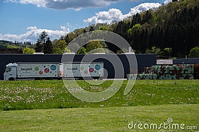 Daun, Germany 29 May 2021, The location of `Dauner` mineral water with a truck and many water boxes in Daun Editorial Stock Photo
