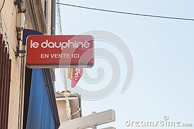 Dauphine Libere logo in front of one of their resellers. Dauphine Libere is a local news and events newspaper from the departement Editorial Stock Photo