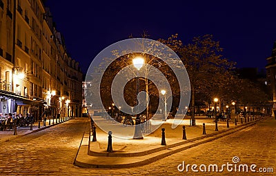 Place Dauphine combines all the beauty and romance of Paris into one beautifully historic square. Editorial Stock Photo