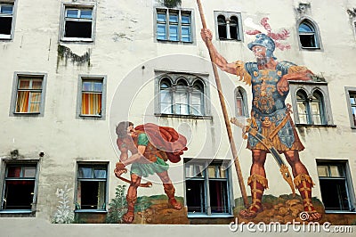 David and Goliath on the house wall ,Regensburg Stock Photo