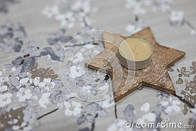 David& x27;s star wooden candle holder with floral background Stock Photo