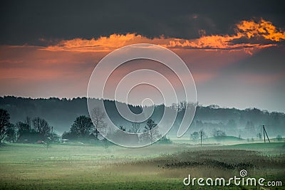 Dawn at misty rural landscape Stock Photo