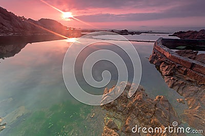 The dawn of the rocky coast Stock Photo