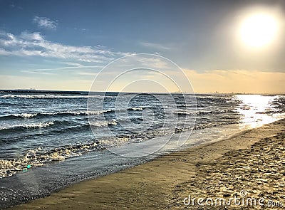 The dawning sun on the beach Stock Photo