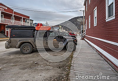 Muddy Jeep on a Street in Dawson City Editorial Stock Photo