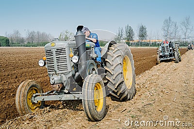 Day annual plowing with vintage tractors. Editorial Stock Photo