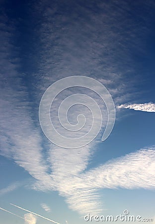 Pretty blue skies after dawn with white puffy clouds opening up for the sunny day ahead Stock Photo