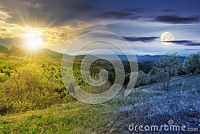 day and night equinox time change concept above mountainous countryside scenery in spring Stock Photo