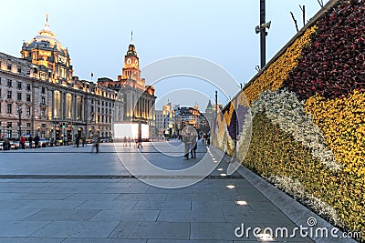 Day view of the Bund of Shanghai and some tourists passing by Editorial Stock Photo