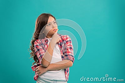 Daydreaming concept. Kid thoughtful face make decision. Child cute curly hair thinking. Hard decision for her. Girl Stock Photo