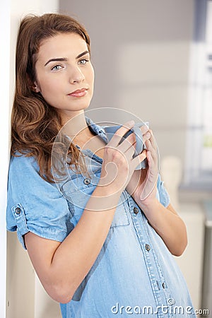 Daydreaming woman drinking tea Stock Photo