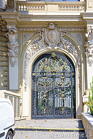 Daylight royal entrance to a building with ornaments Stock Photo