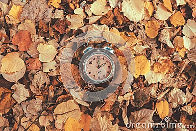 Daylight saving time concept, old analog alarm clock set to two o'clock Stock Photo
