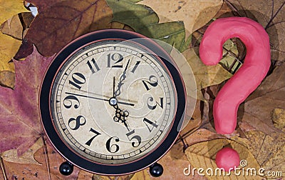 Daylight Saving Time. Wall Clock going to winter time. Autumn abstraction. Stock Photo