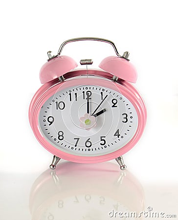 Daylight savings time pink clock Stock Photo