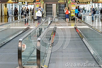 Daylighting roof structure with people walking and people movers Editorial Stock Photo