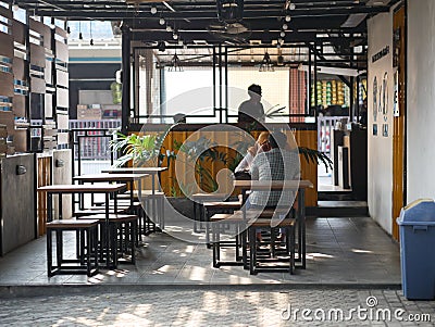 the daytime atmosphere in the coffee shop, people talking to each other, the interior of the coffee shop Editorial Stock Photo