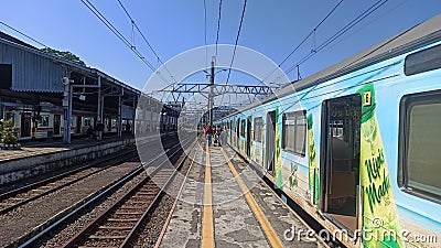 Daytime atmosphere at the commuter line train arrival Editorial Stock Photo