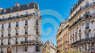 Daytime shot of typical French residential buildings in Batignolles under the blue sky Stock Photo