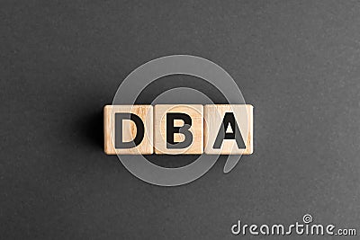 DBA - acronym from wooden blocks with letters Stock Photo