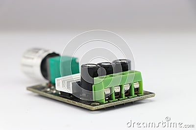 DC Motor speed controller board that regulates motor speed using pulse width modulation method kept on a white background Stock Photo