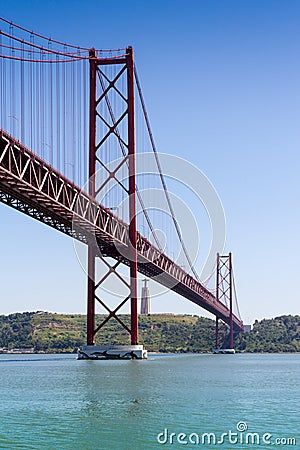 The 25 de Abril Bridge (Ponte 25 de Abril) is a suspension bridge in Lisbon, Portugal Stock Photo