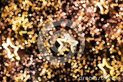 Blurred glittering star lights of Christmas Tree Bokeh background Stock Photo