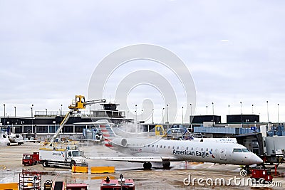 De-icing top of American Eagle aircraft at OHare Airport in Chicago Illiniois USA 1 - 12- - 2018 Editorial Stock Photo