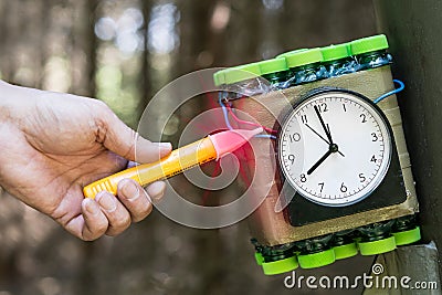 Explosive device detail. Time bomb disposal expert. Dummy weapon Stock Photo