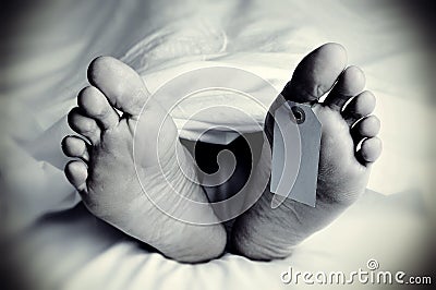 Dead body with a blank toe tag, in monochrome Stock Photo