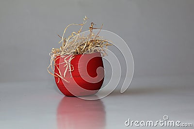 A dead plant in a red pot. A withering flower in a pot Stock Photo