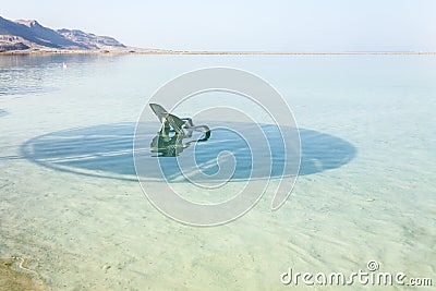 Dead Sea, Israel. White lounge chair floating in the water Stock Photo