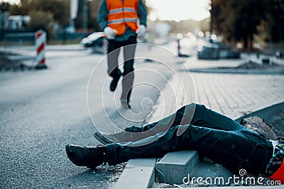 Dead victim during roadworks. Non-compliance with health and safety regulations Stock Photo