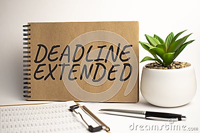 DEADLINE EXTENDED paper notepad on office work place Stock Photo