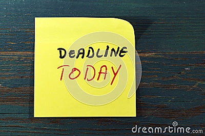 Deadline today post it on wood Stock Photo