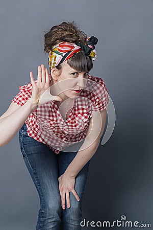 Deaf-like woman with hand on ear leaning to understand Stock Photo