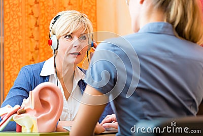Deaf woman takes a hearing test Stock Photo
