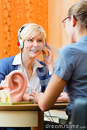 Deaf woman takes a hearing test Stock Photo