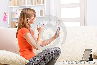 Deaf woman using sign language on the smartphone Stock Photo