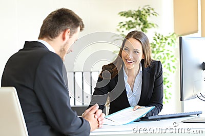 Dealer attending to a customer Stock Photo