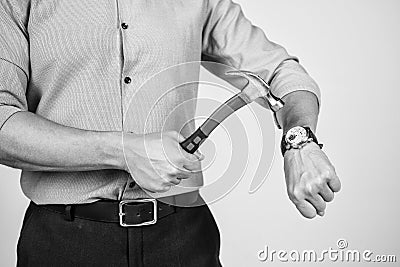 Dear stress, lets break up. Manager cropped view crash wrist watch with hammer. Time break. Time-break. Deadline and Stock Photo