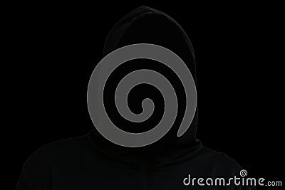 Death suit isolated on black background. An impersonal black robe with a hood, a symbol of death. Halloween concept Stock Photo