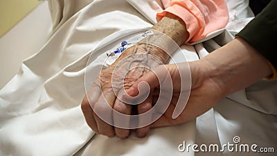 Deathbed old age care of grandmother bedridden with a cannula, close up shot Stock Photo
