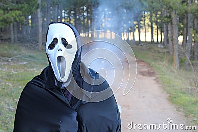 Deathly entity walking in the forest Stock Photo