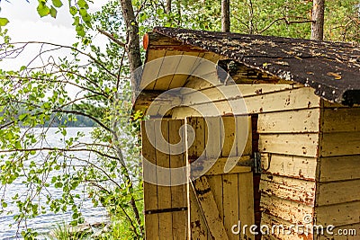 Deatil of an old wooden changing cabin on the shore of the Saimaa lake in Finland - 2 Stock Photo