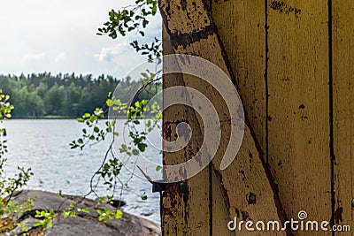 Deatil of an old wooden changing cabin on the shore of the Saimaa lake in Finland - 8 Stock Photo