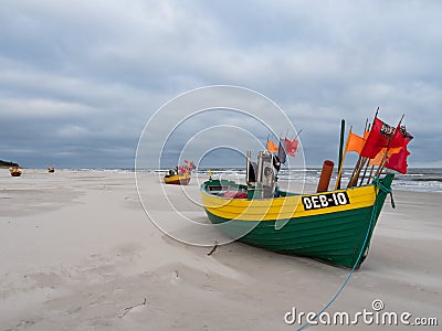 Debki beach, colorful fishing boats at the seashore. Poland Editorial Stock Photo